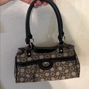 Vintage Etienne Aigner Black and Tan Patterned Shoulder Bag with gold hardware.